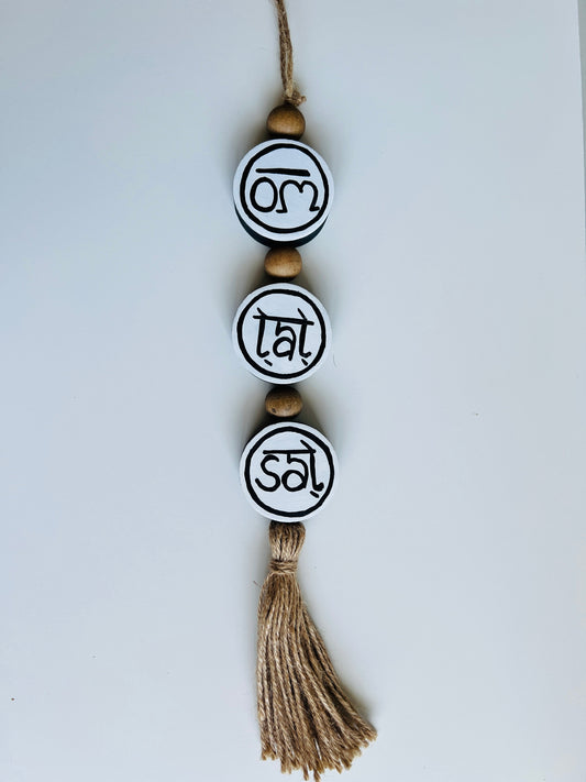 om tat sat round hanging