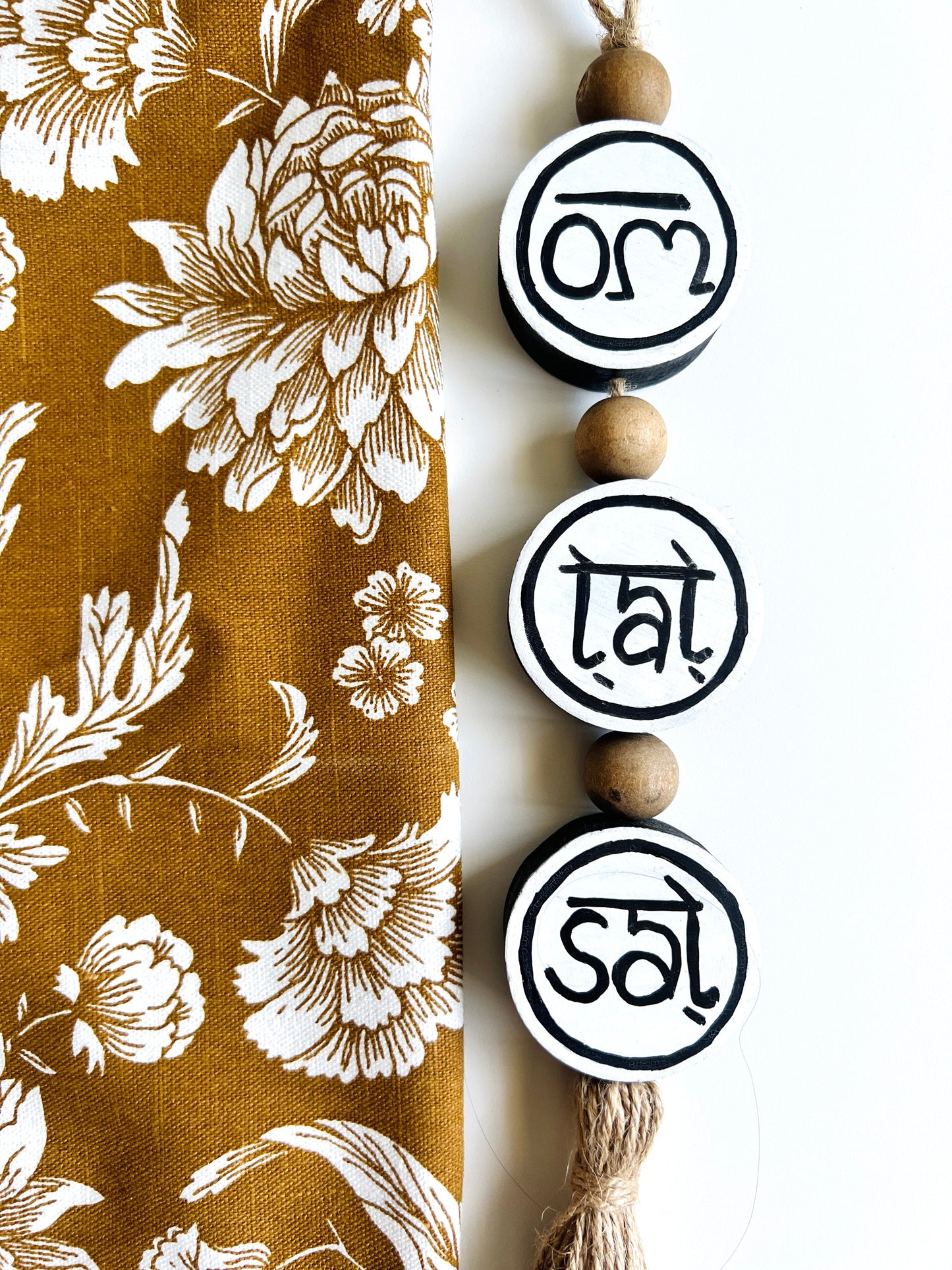 om tat sat round hanging