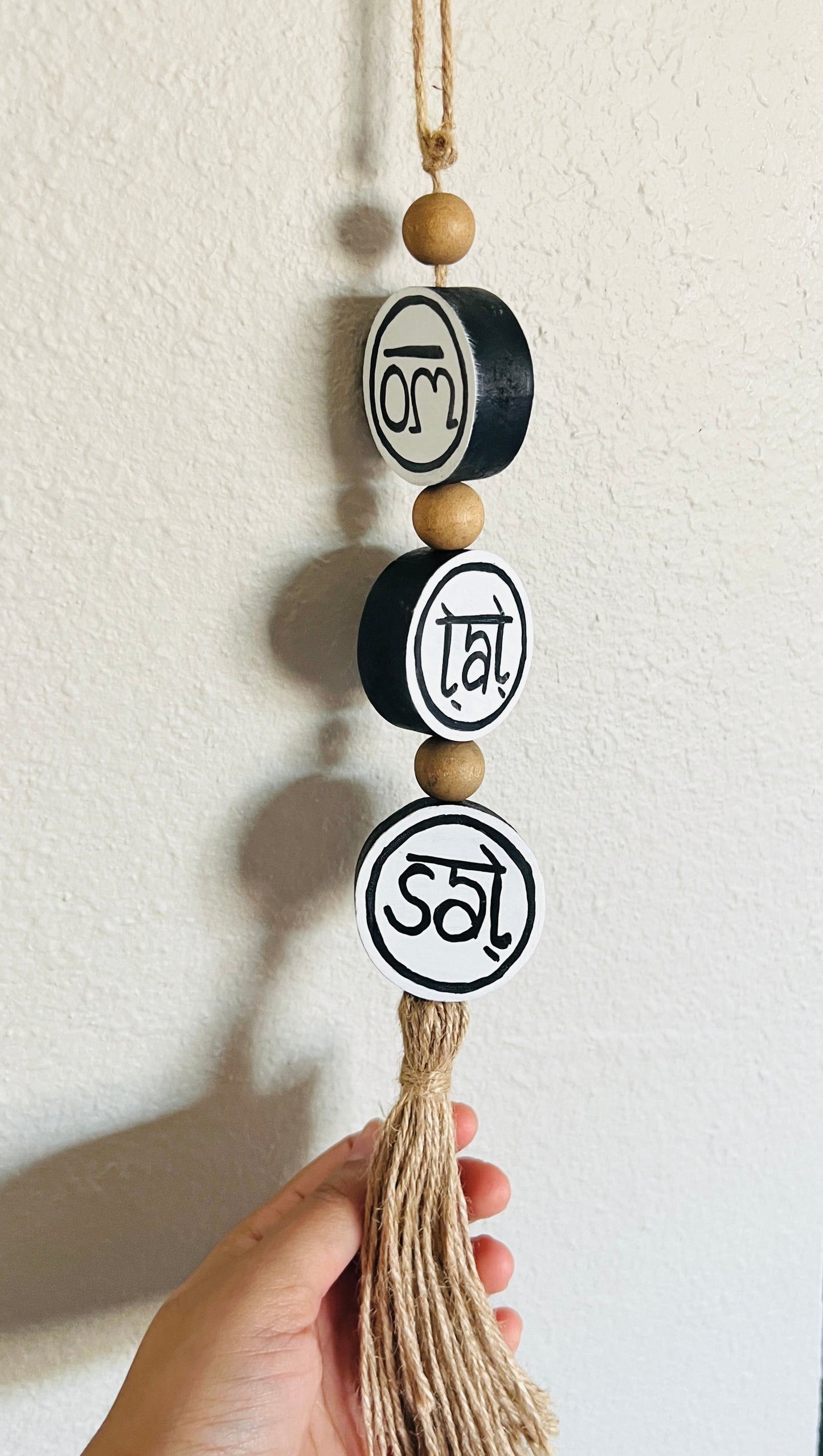 om tat sat round hanging