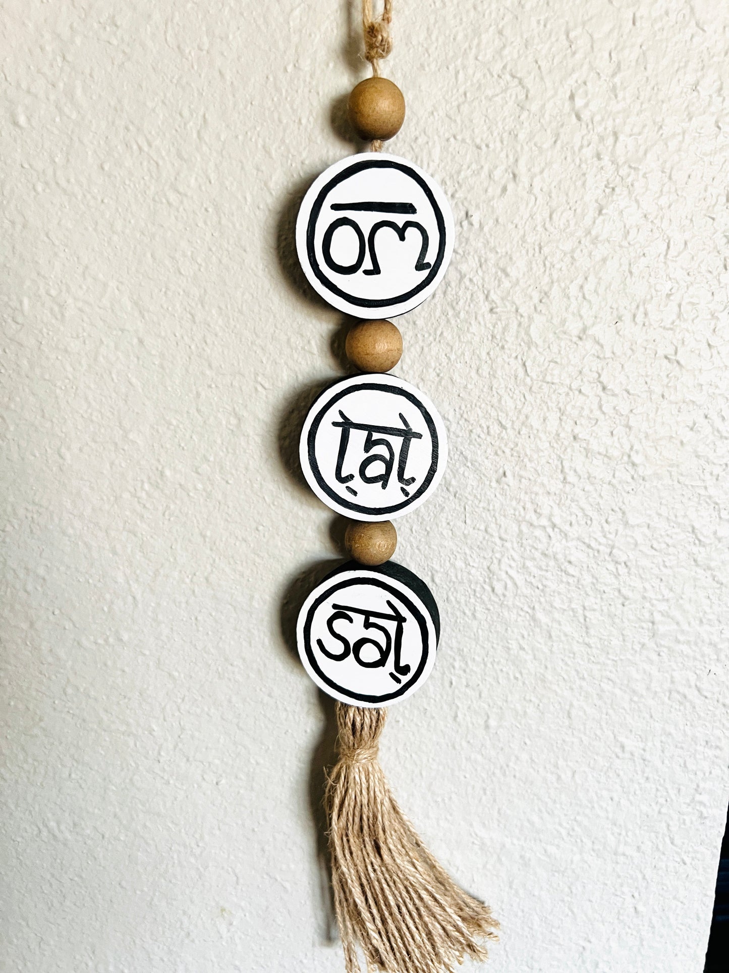 om tat sat round hanging